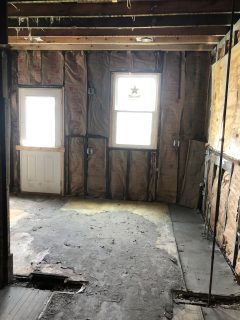 Before A room that is being remodeled with drywall and insulation in preparation for East Chicago siding installation.